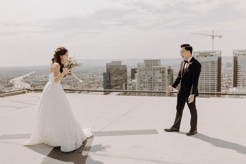 Bride and groom first look overlooking LA