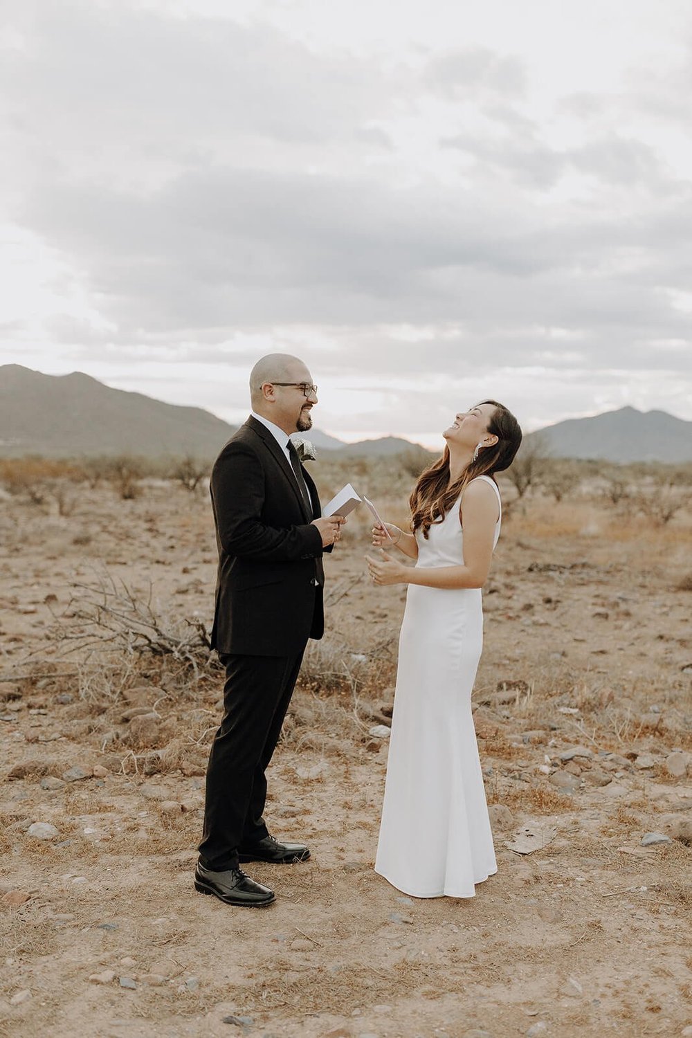 Bride and groom exchange personal vows in the Arizona desert