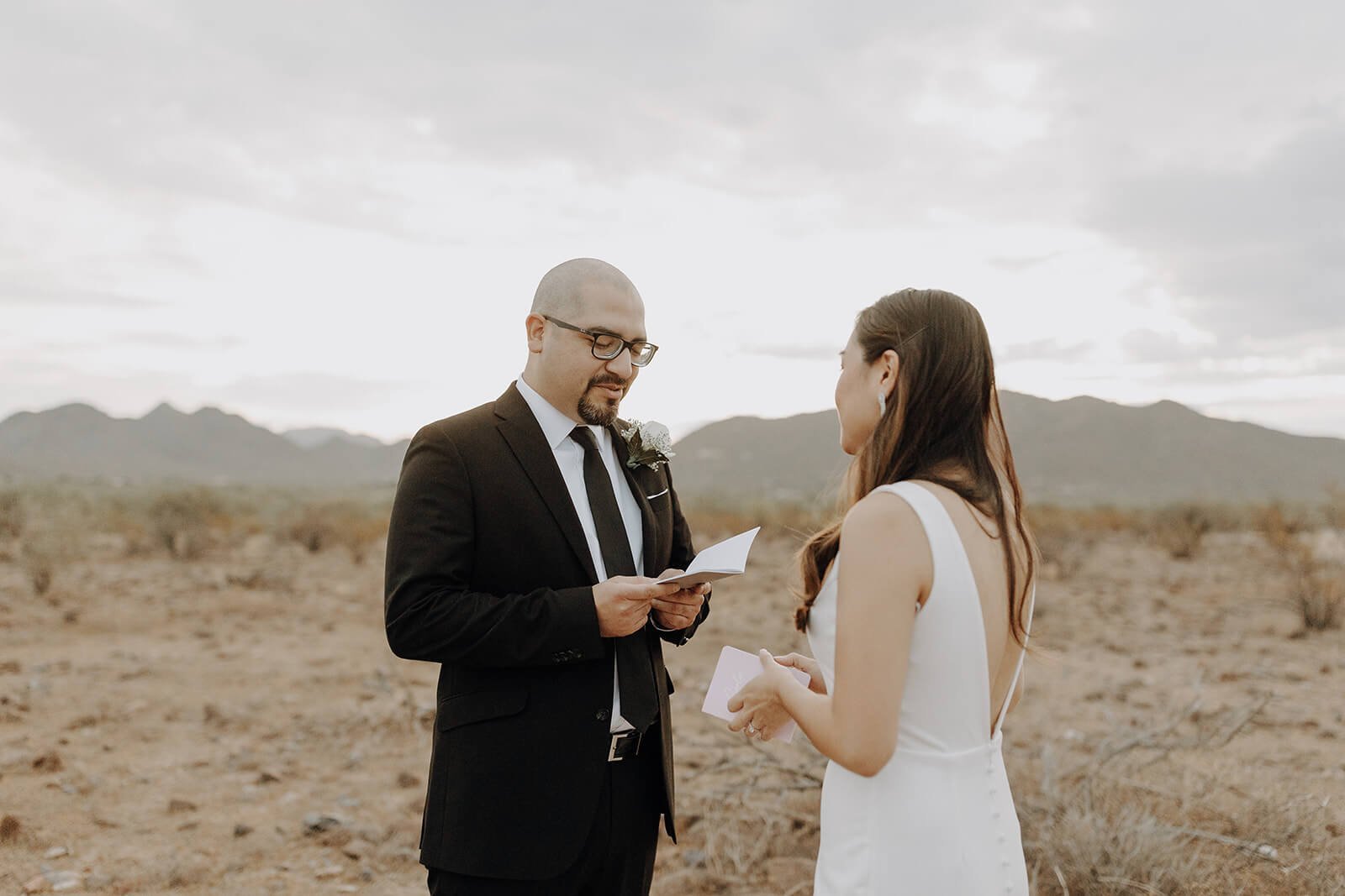 Bride and groom exchange personal vows in the Arizona desert