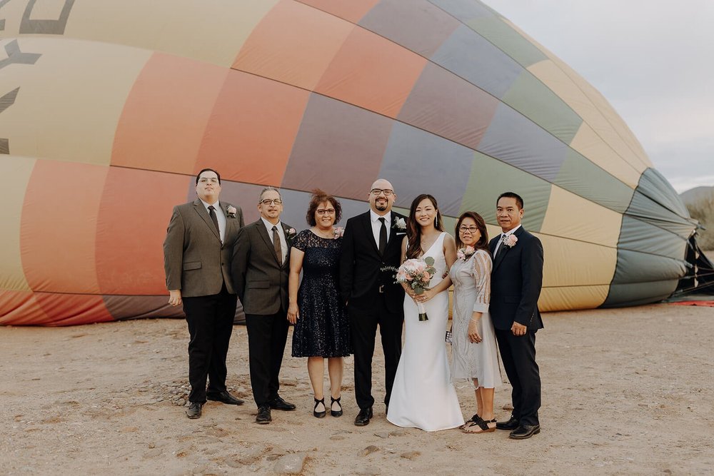 Wedding portraits beside a hot air balloon in Arizona