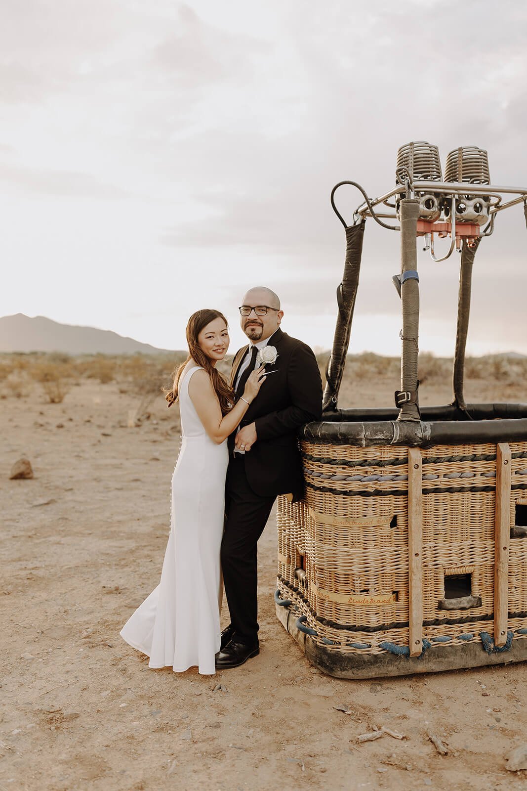 Bride and groom couple portraits inside a hot air balloon basket