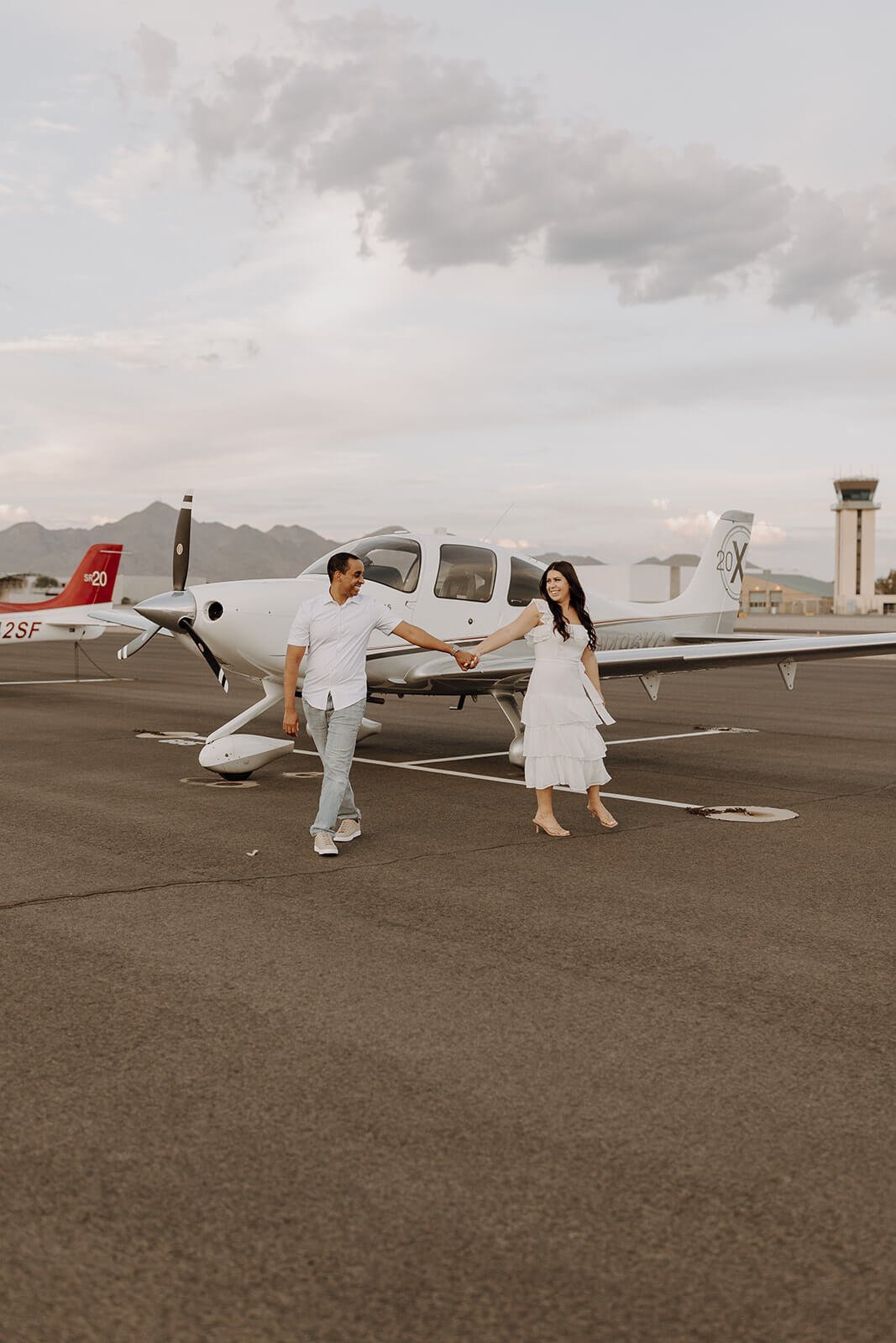 Couple dancing near plane at Scottsdale airport