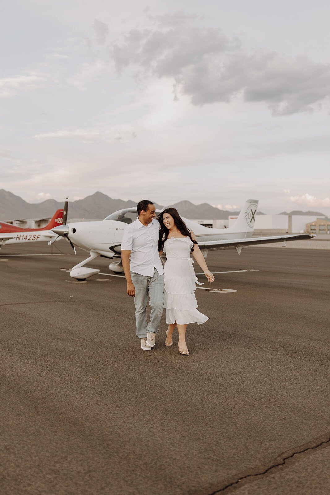 Couple walking across the air strip at Scottsdale airport