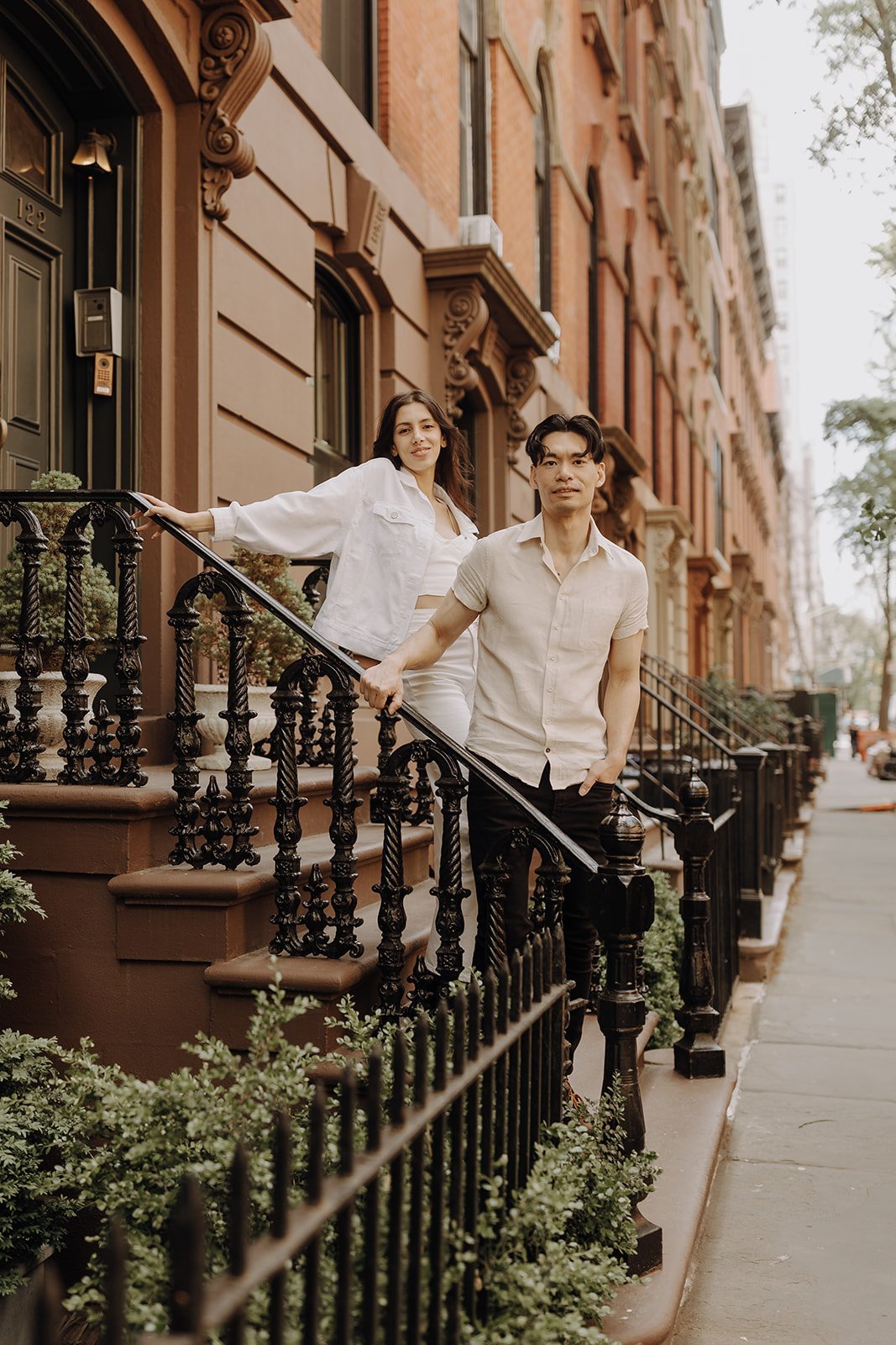 Couple standing on the stoop during New York City Engagement Session in Manhattan