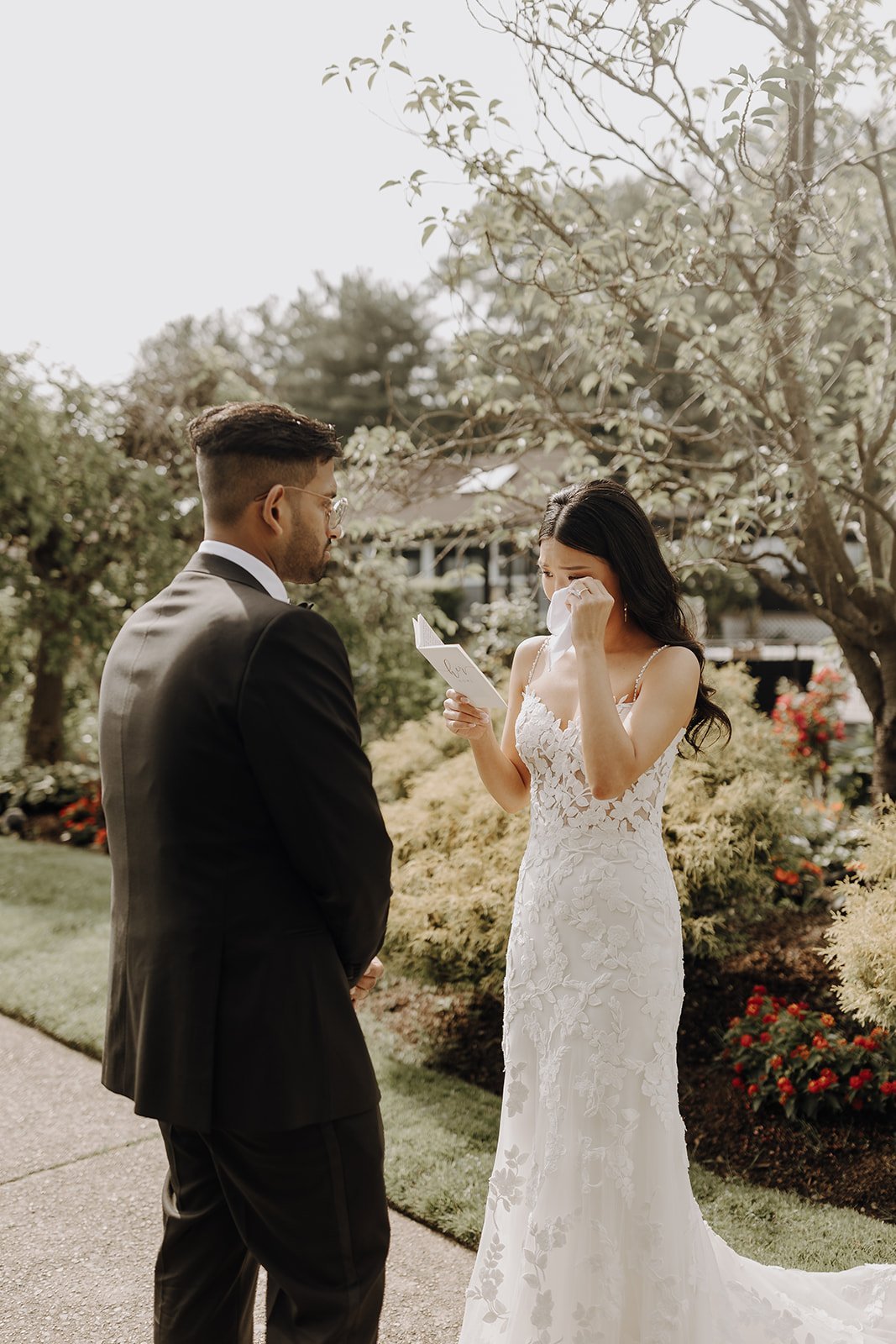 Bride tears up while reading vows during NYC wedding photos