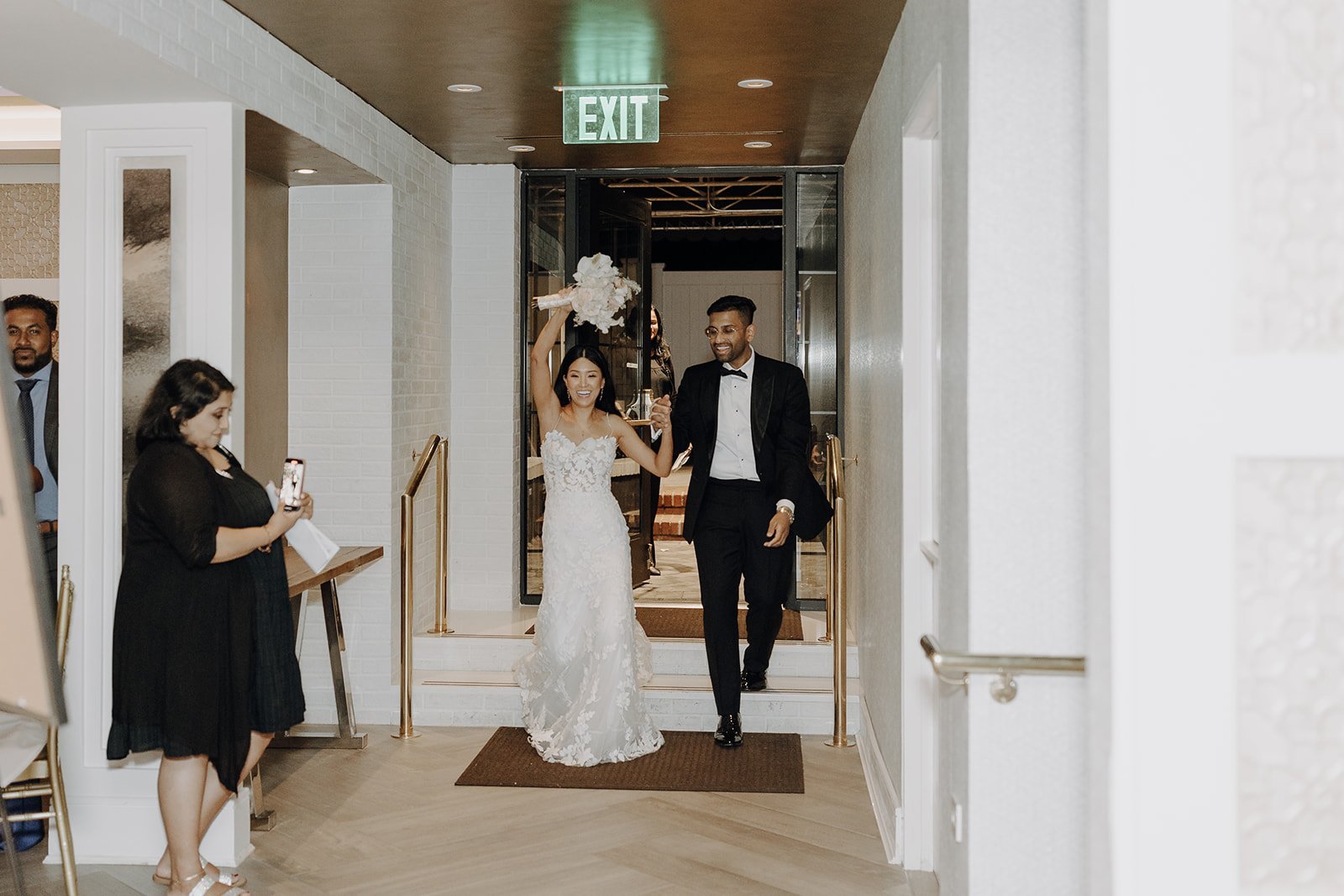 Bride and groom enter their city wedding reception in NY