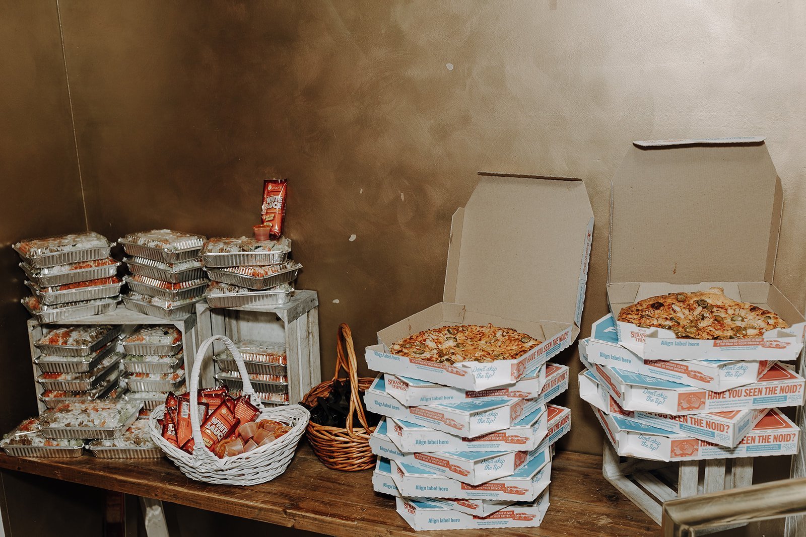 Stacks of pizza boxes for NYC wedding reception