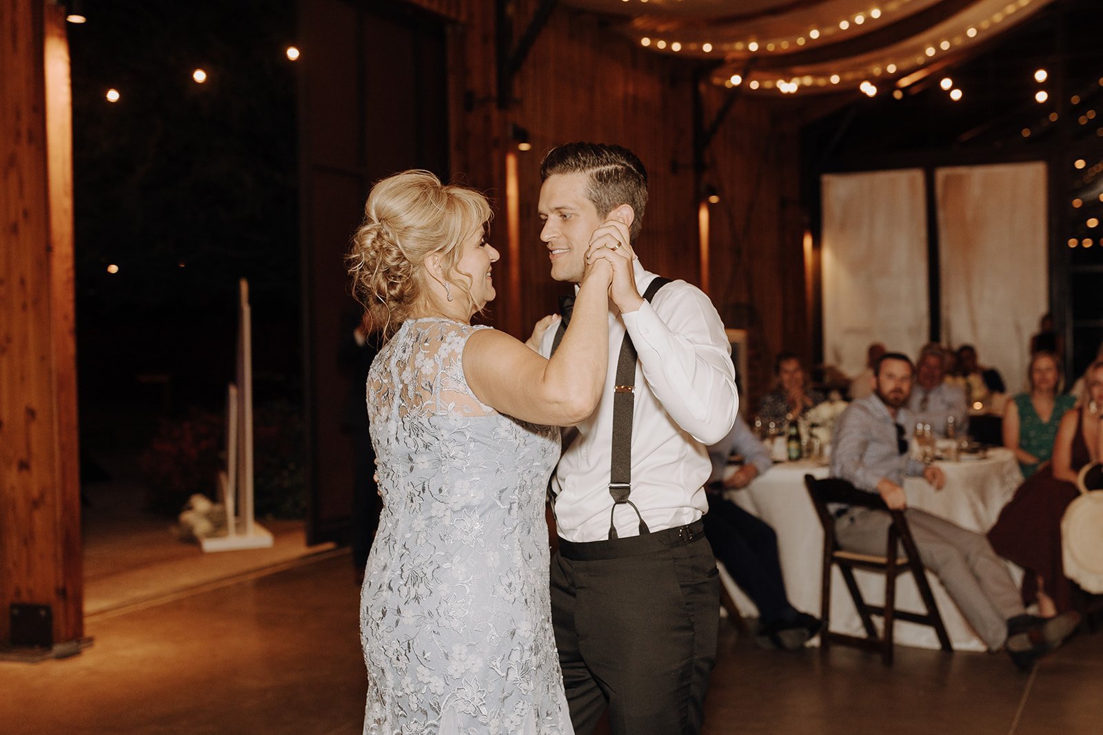 Groom and mother first dance at desert wedding reception