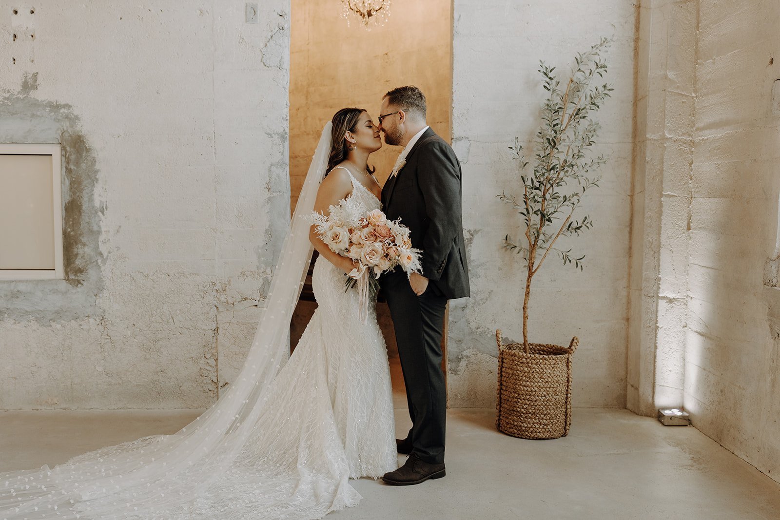 Bride and groom nuzzle noses during couple portraits during Austin wedding
