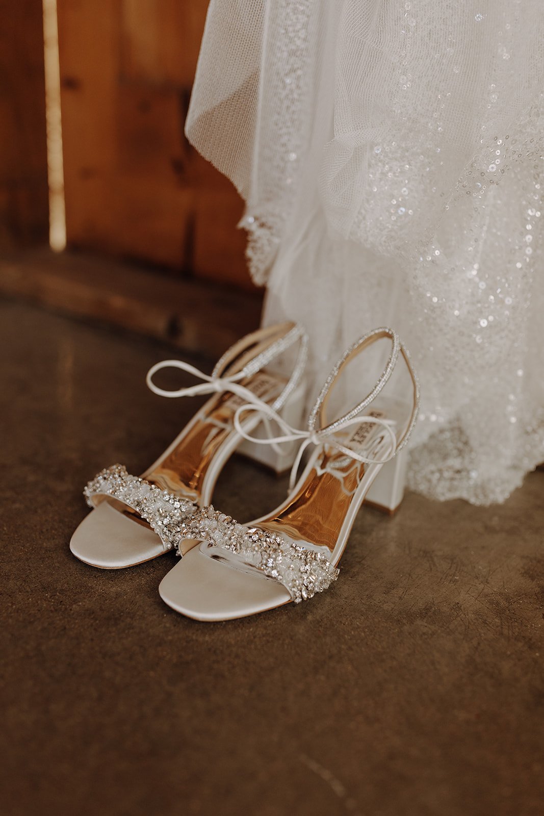 Sparkly white wedding dress by Made with Love with matching sandals