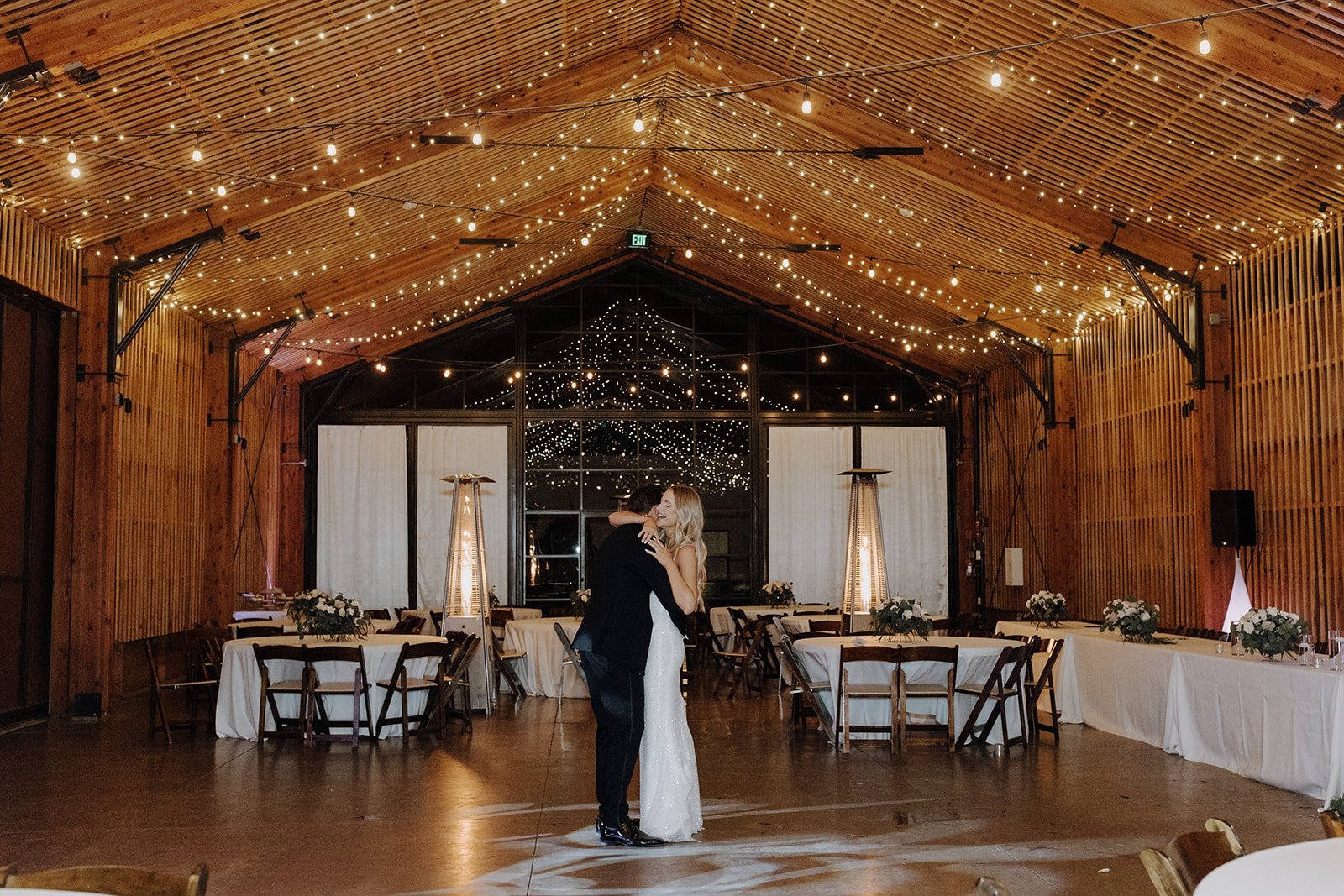 Bride and groom dance in the Paseo wedding venue 