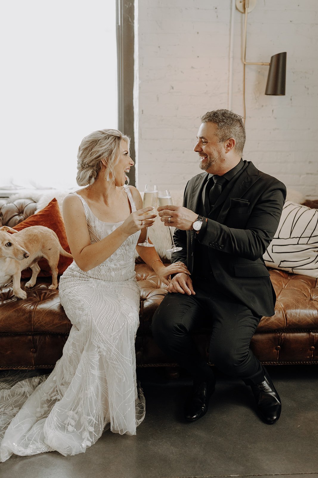 Bride and groom cheers with champagne after wedding ceremony at Company 251