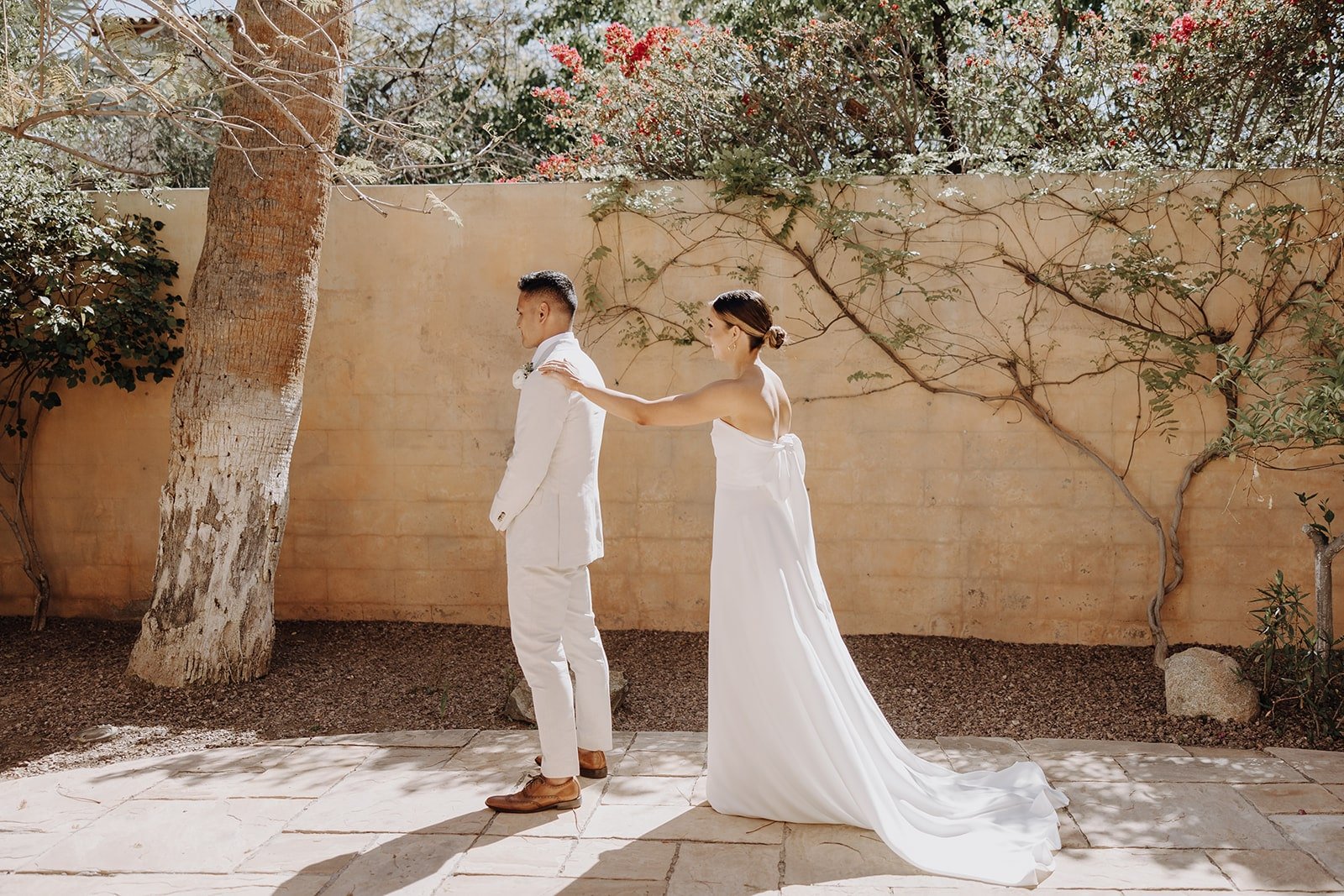 Bride and groom first look outside at luxury resort wedding in Arizona