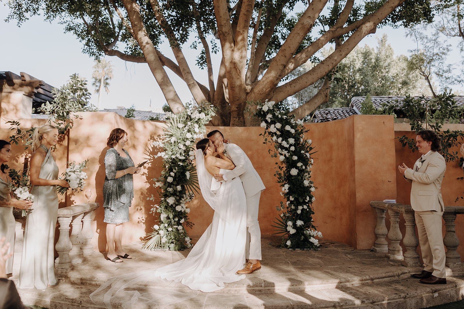 Bride and groom kiss at outdoor wedding in Arizona