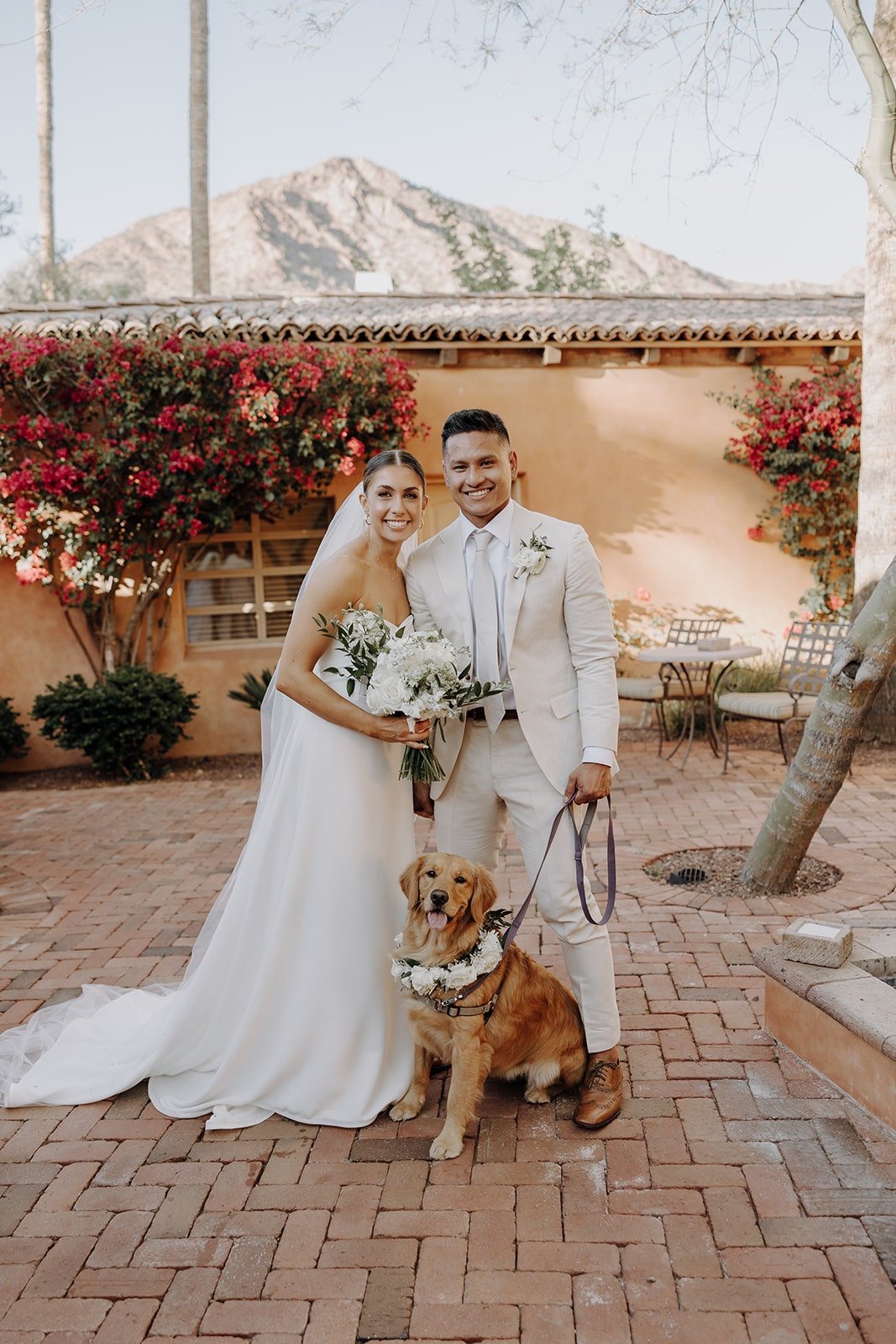 Bride and groom photo with their golden retriever at Royal Palm Resort &amp; Spa