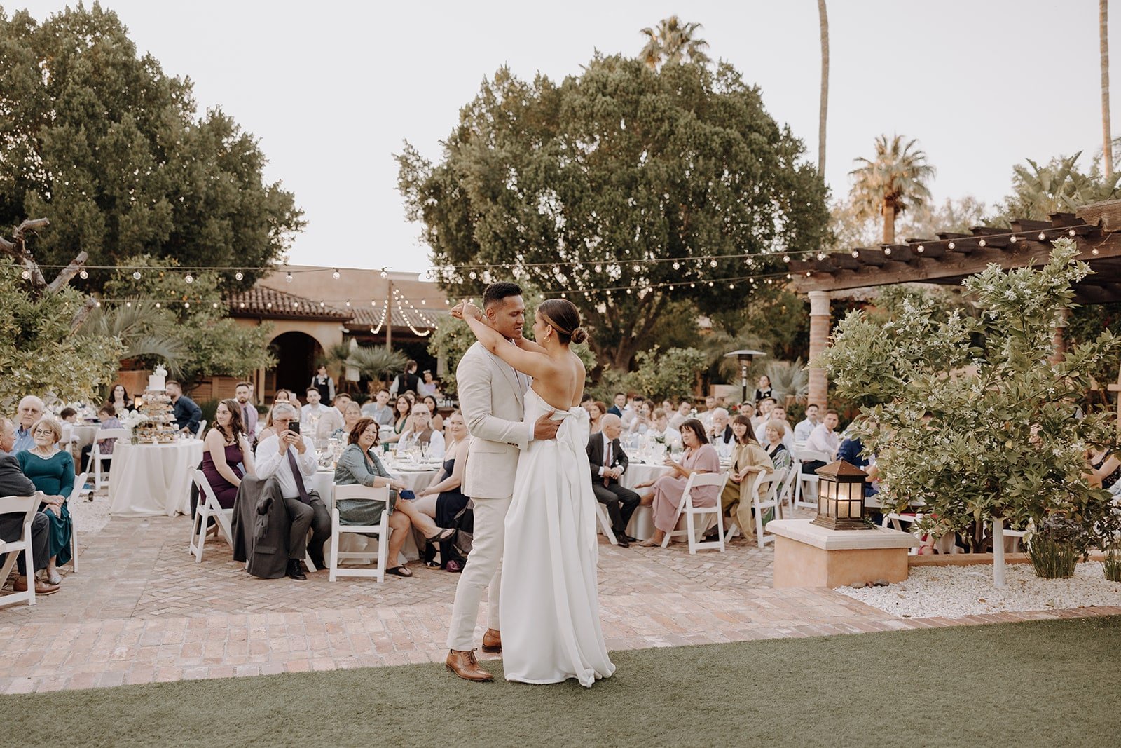 Bride and groom first dance on the lawn at Royal Palm Resort &amp; Spa
