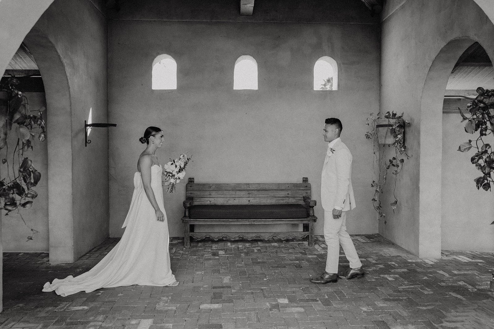 Bride and groom walk towards each other during wedding photos at Royal Palms Resort &amp; Spa wedding venue in Arizona