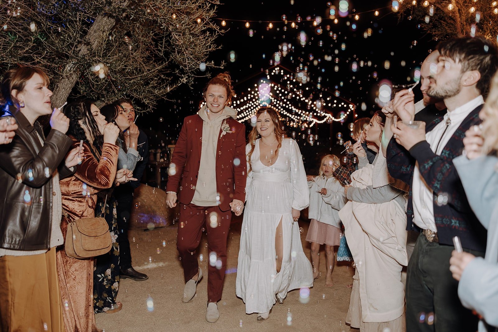 Bride and groom bubble exit after their Joshua Tree wedding