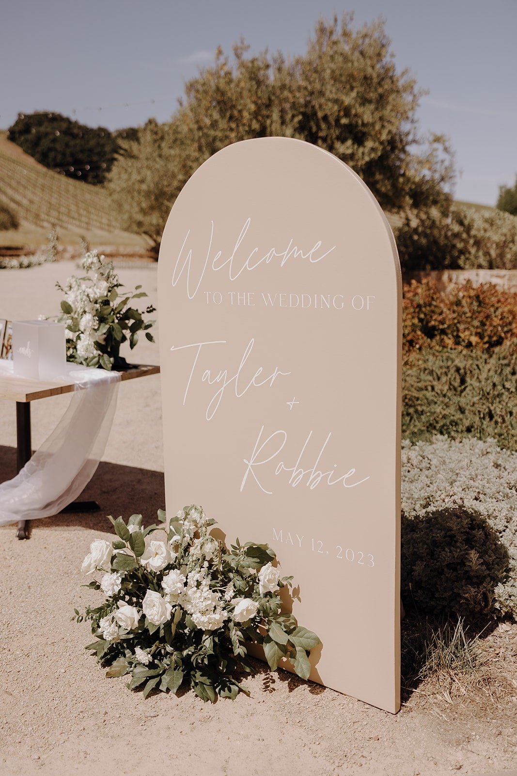 Beige and white luxury wedding sign at Tuscan-style wedding in California