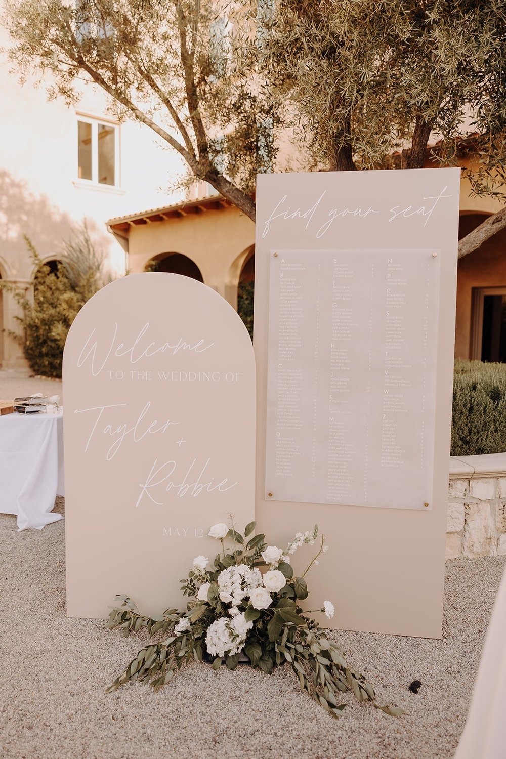 Beige and white wedding sign at Tuscan-themed wedding in California