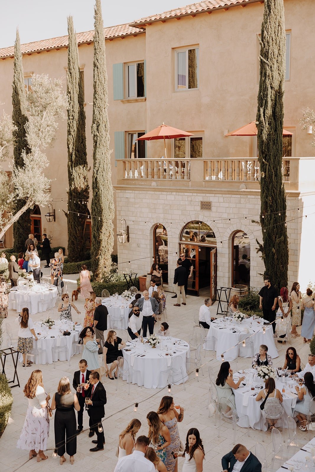 Guests mingle at Tuscan wedding venue in California