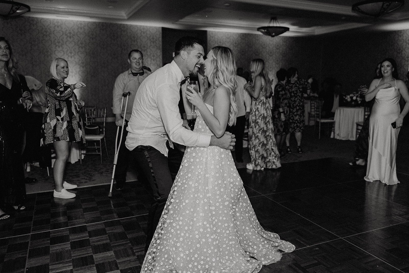 Bride and groom dance at their reception at Allegretto Vineyard Resort