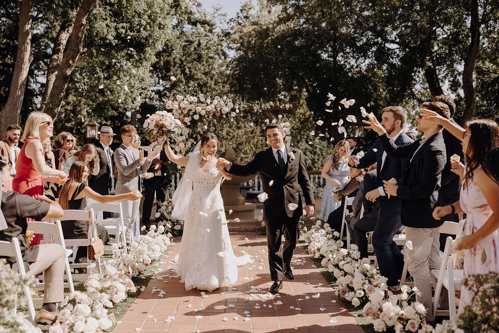 Bride and groom exit their Washington wedding ceremony at Lairmont Manor