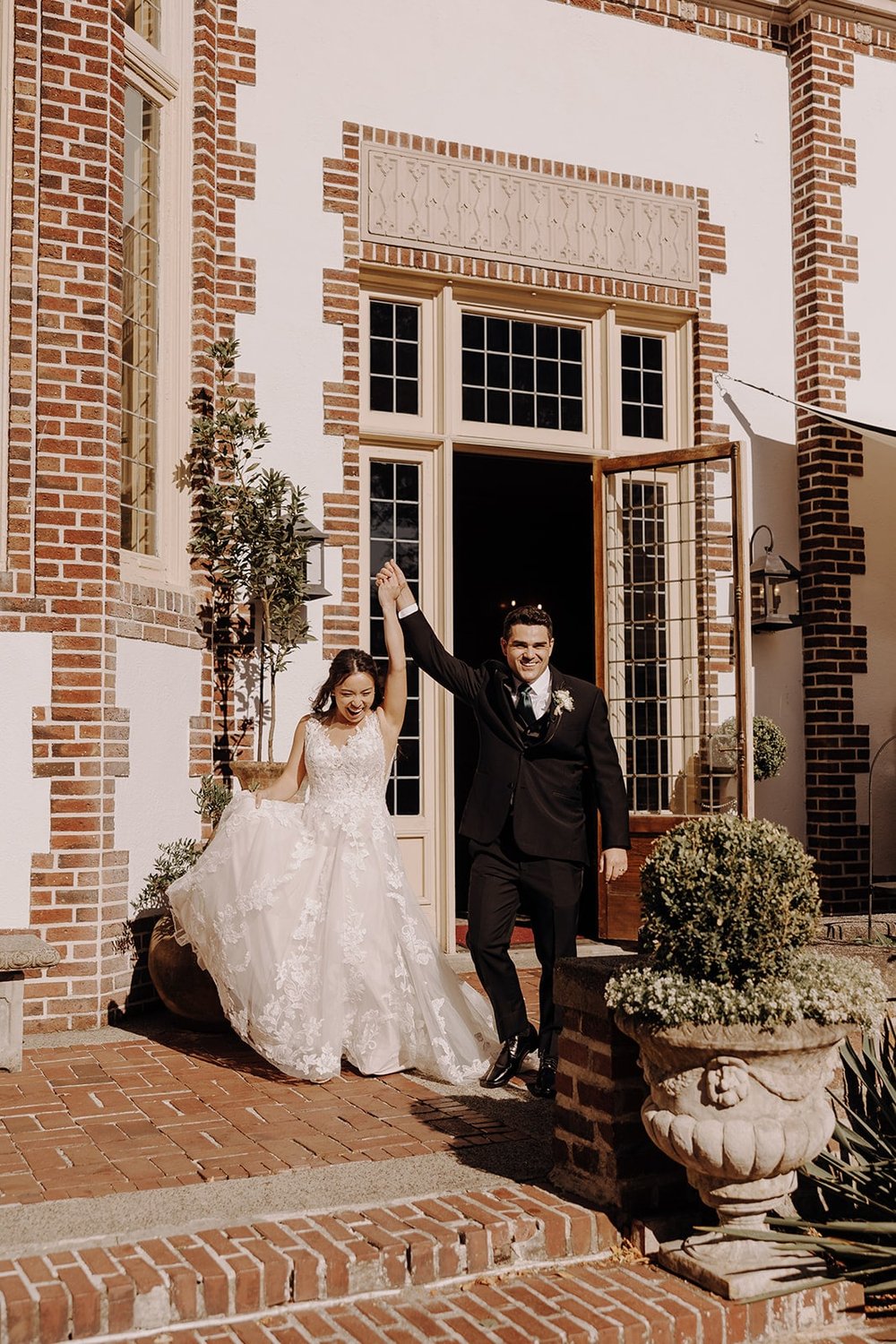 Bride and groom enter their outdoor wedding reception at Lairmont Manor