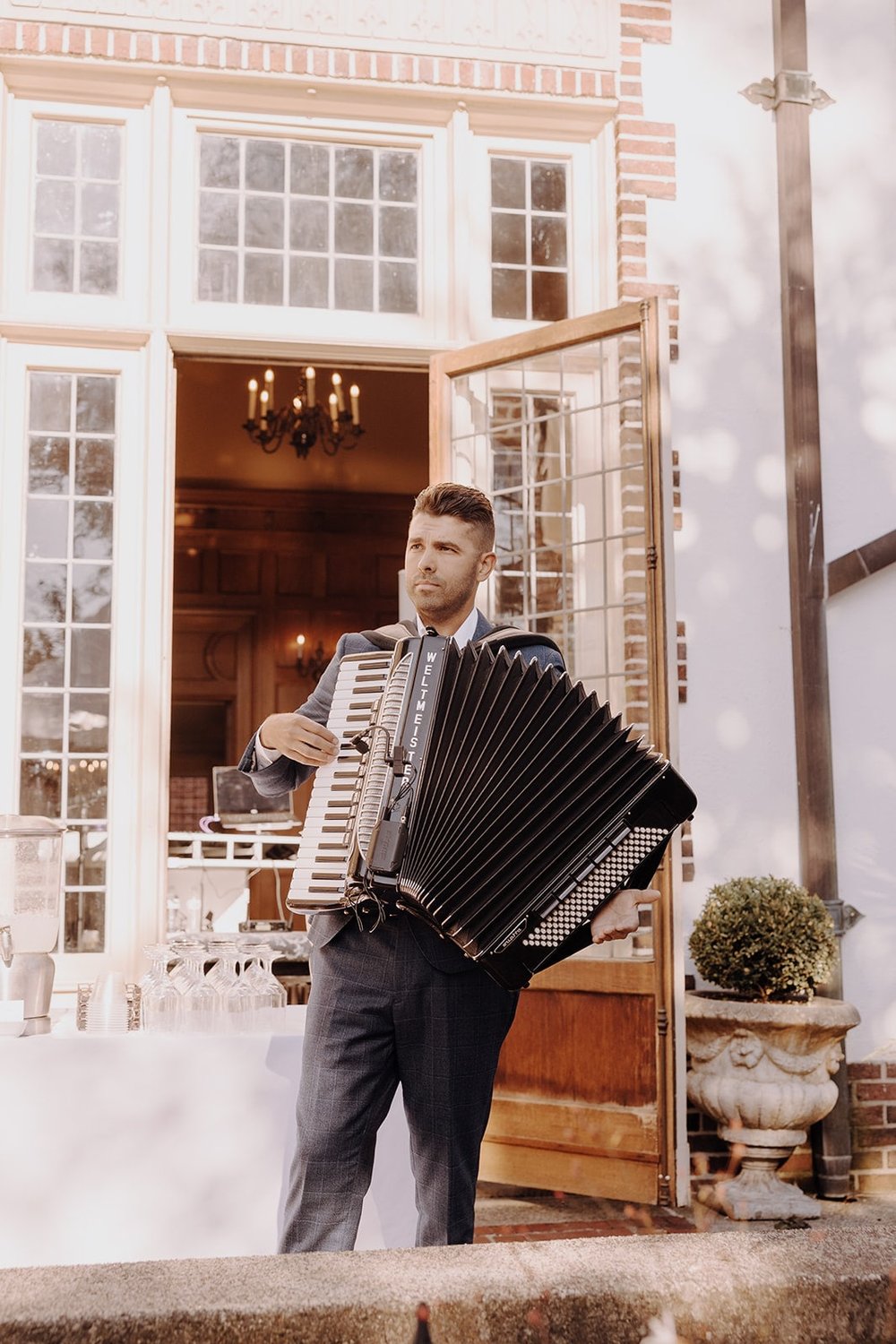 Guest plays accordion during Washington wedding reception at Lairmont Manor