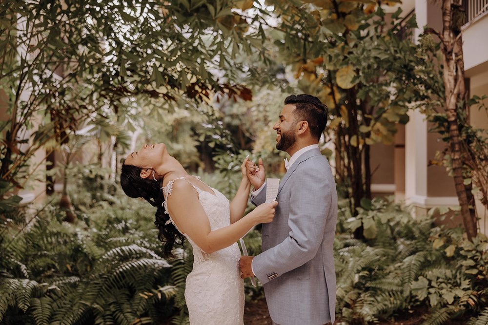 Bride and groom laugh during wedding first look at Dreams Royal Beach Punta Cana wedding