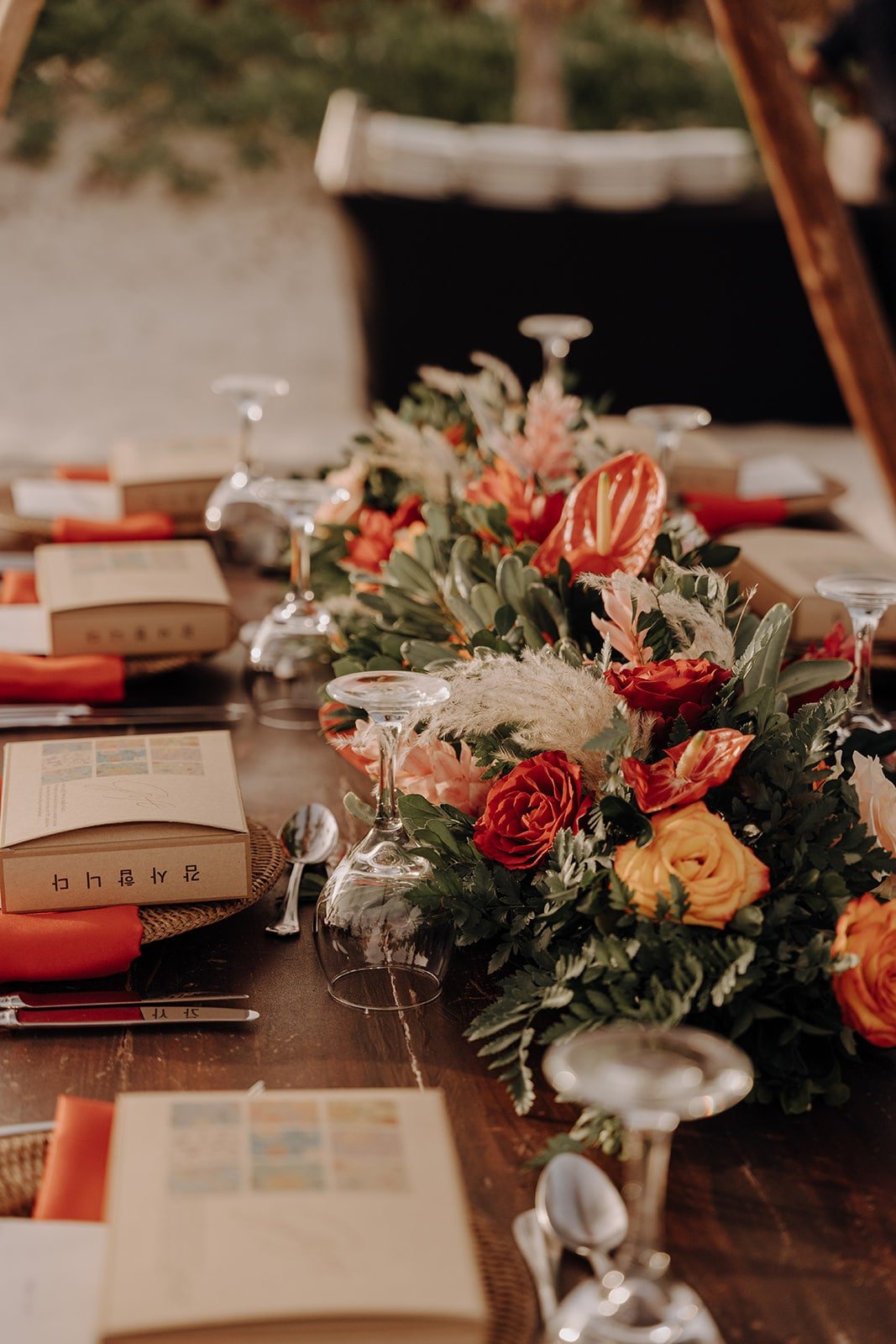 Red, green, and orange table decorations at destination wedding in the Dominican Republic