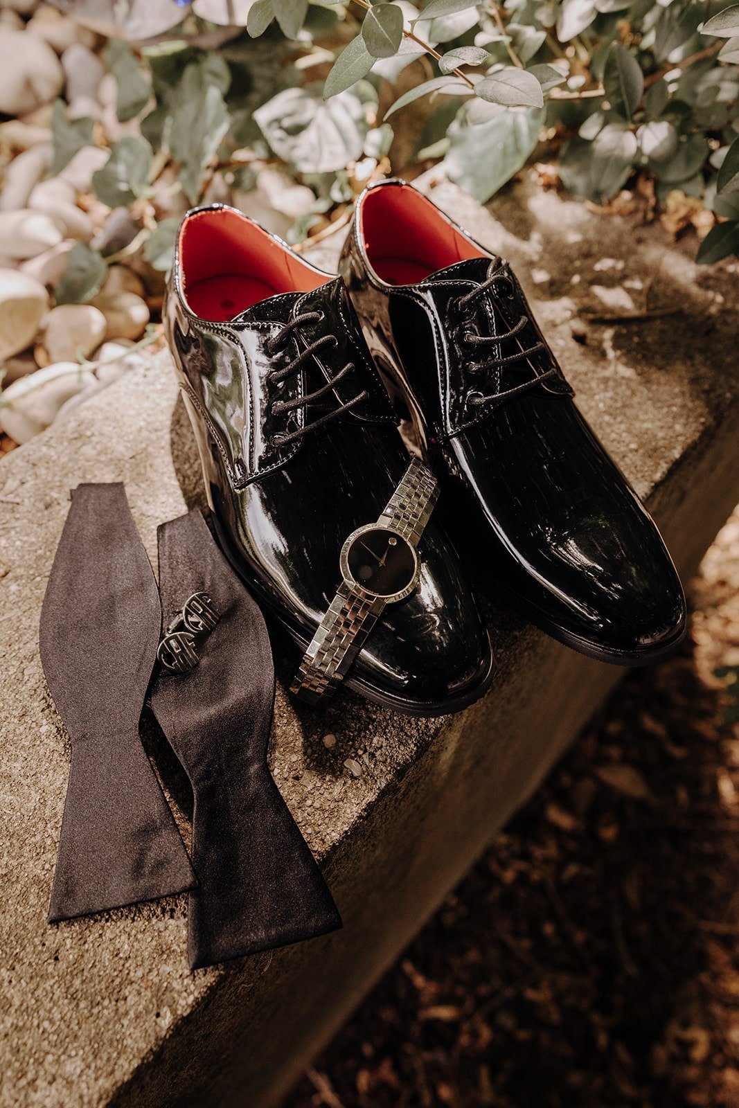 Black patent leather dress shoes and details