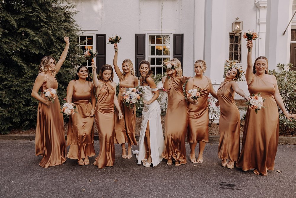 Bridesmaids dance during wedding portraits at New York wedding