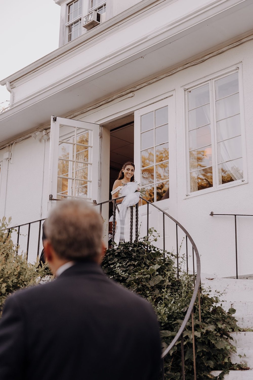Bride walks down the steps at Crabtree's Kittle House for her New York wedding ceremony