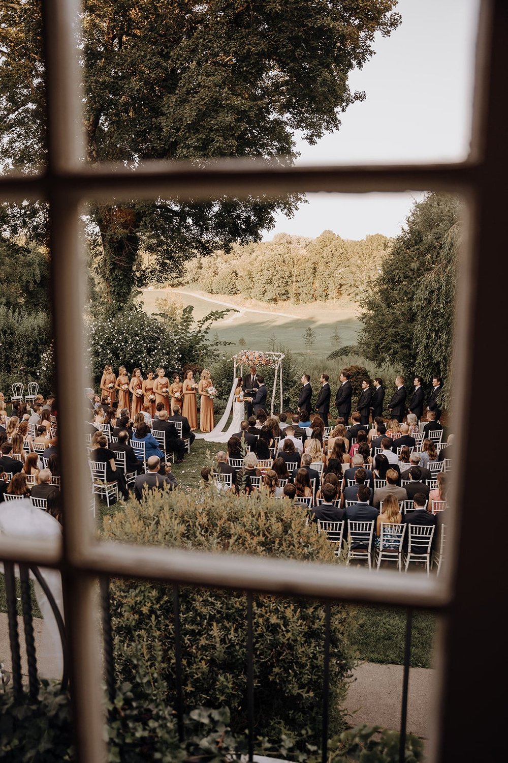 Outdoor wedding ceremony at Crabtree's Kittle House wedding venue in New York