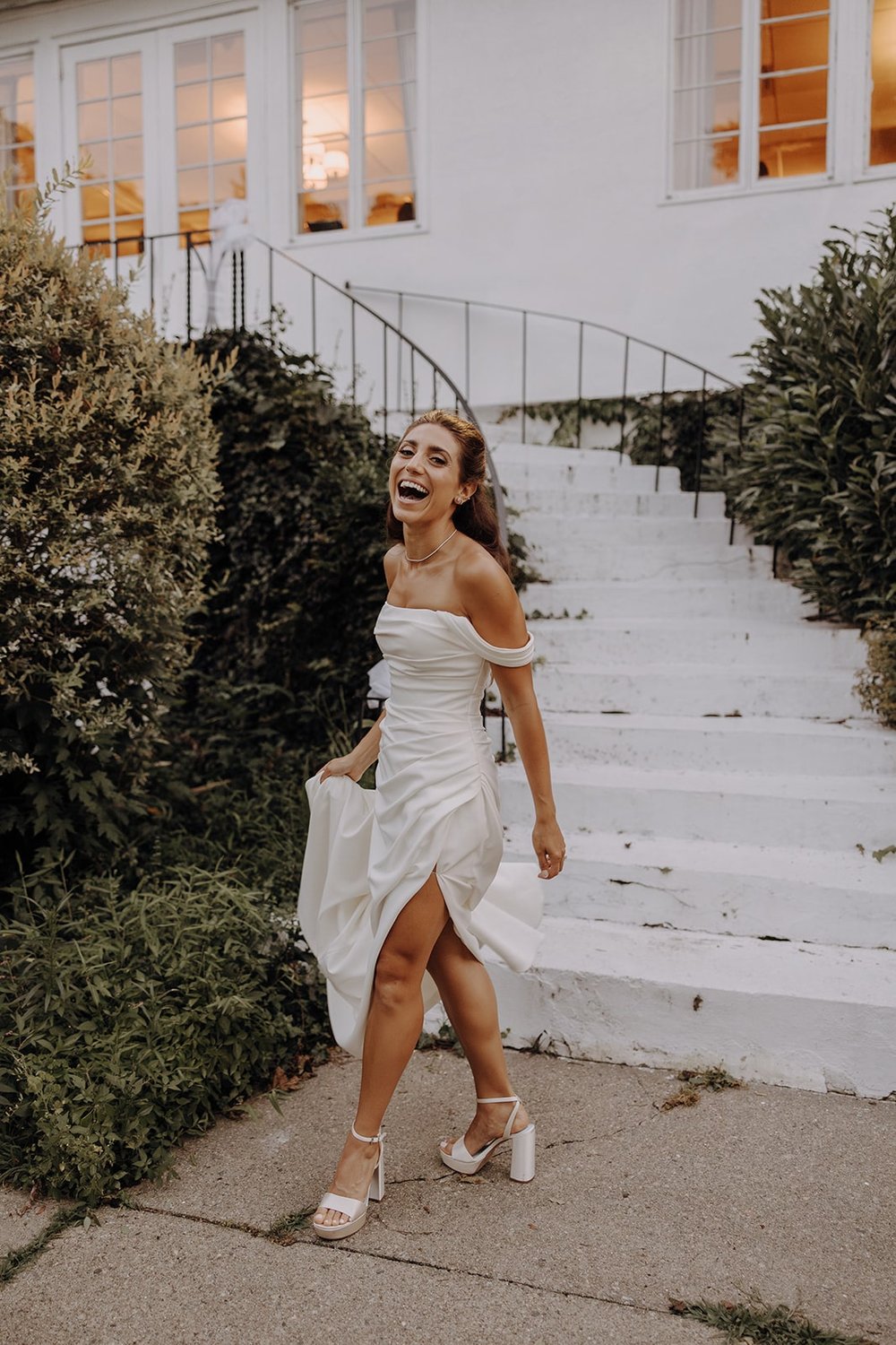 Bride laughs during wedding portraits at New York wedding venue