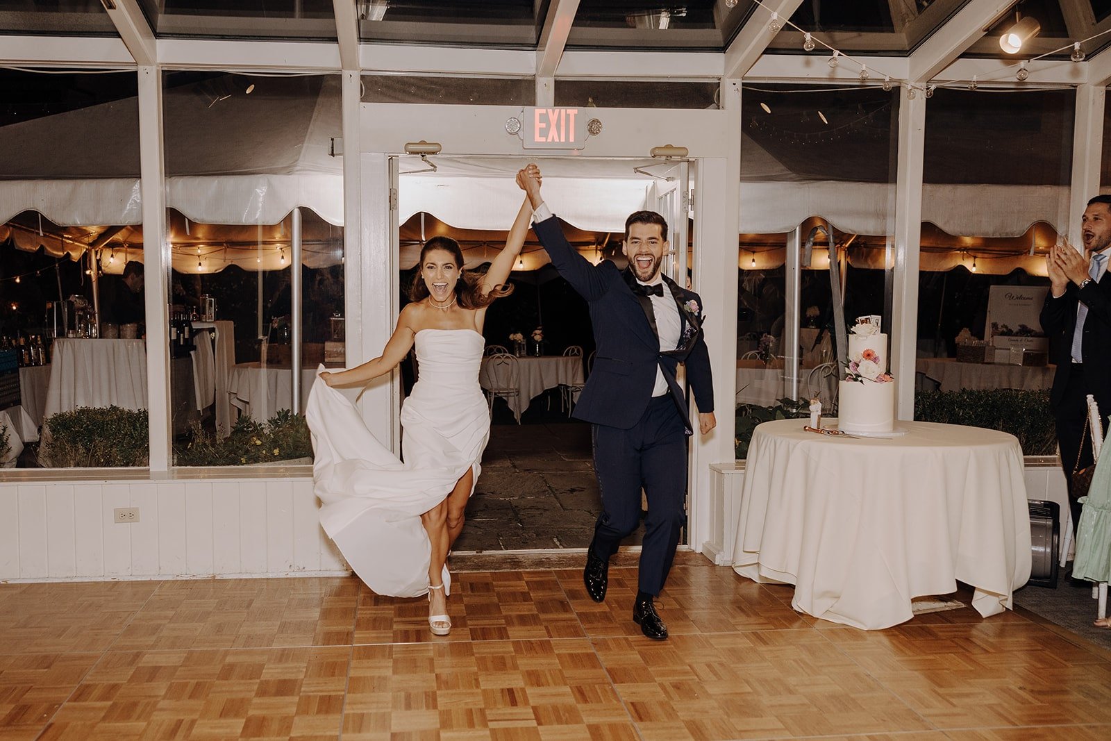 Bride and groom enter their New York wedding reception at Crabtree's Kittle House