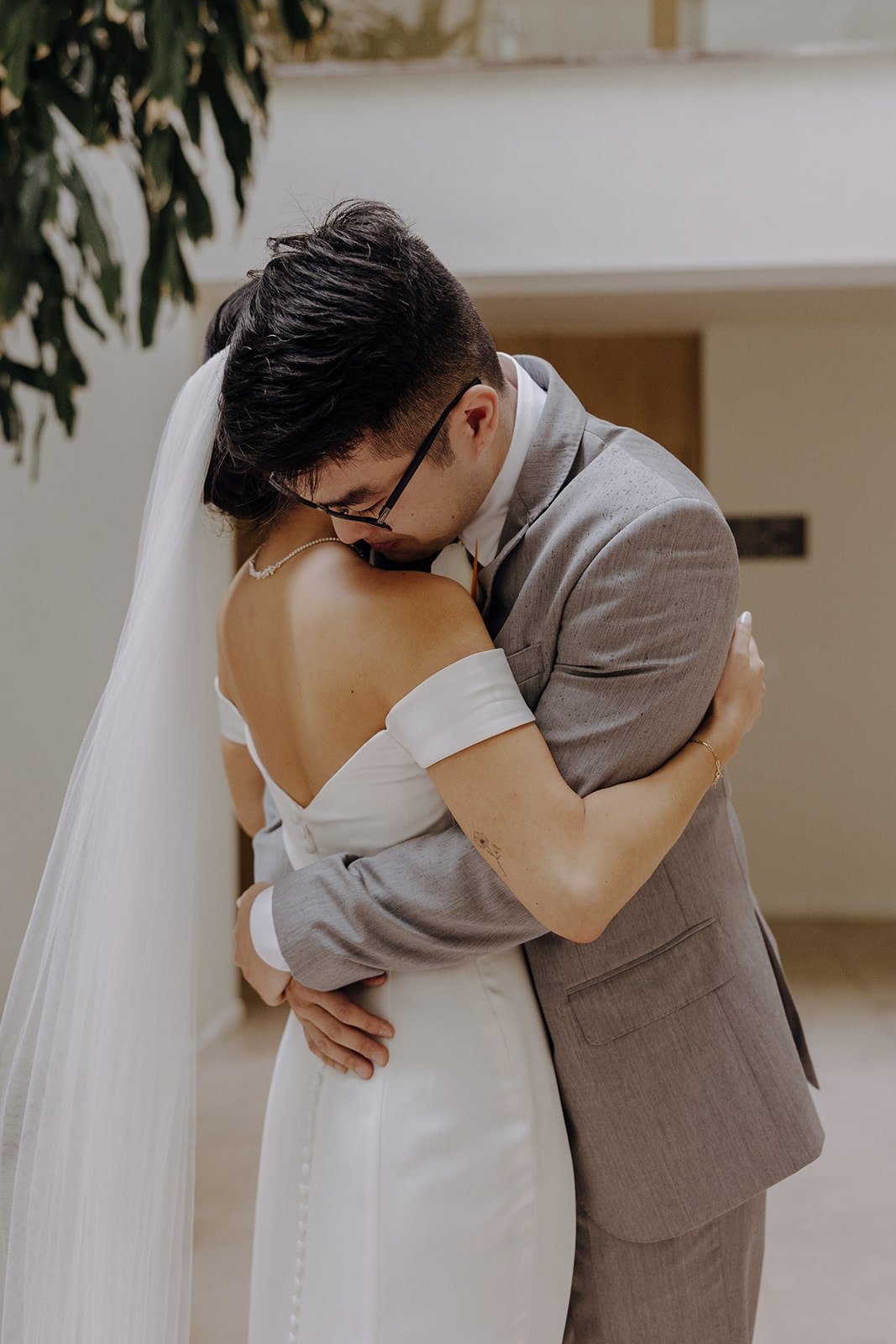 Bride and groom hug during their first look at their resort wedding