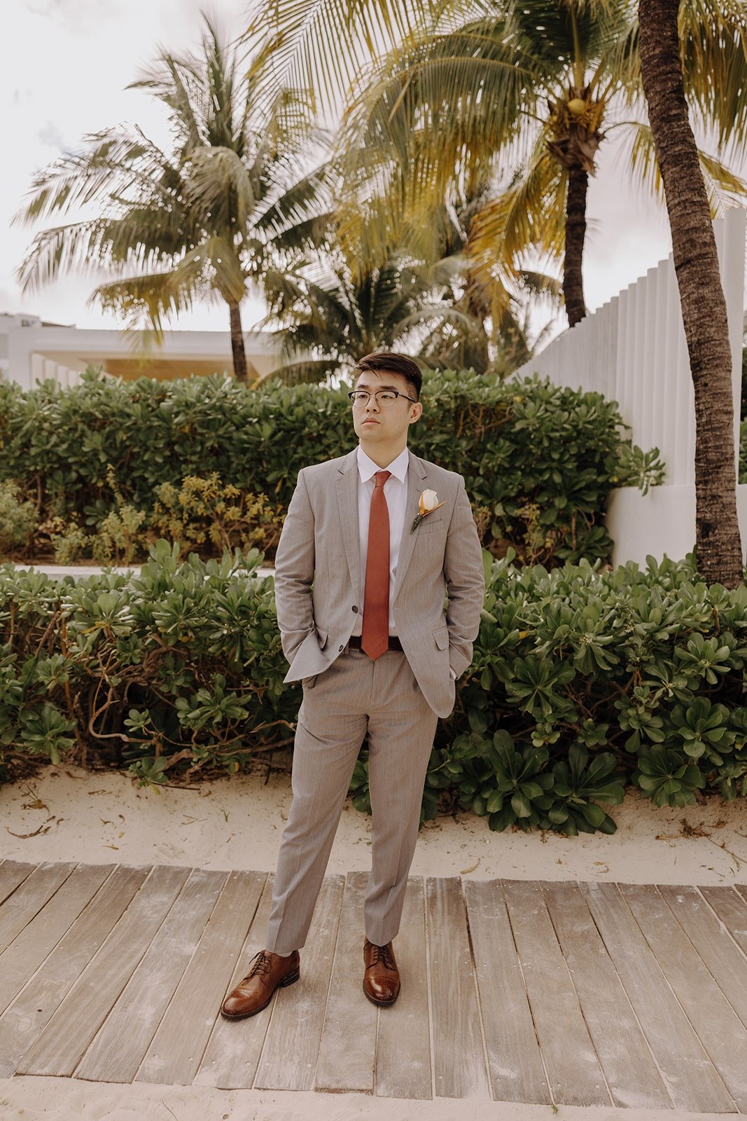 Groom portrait at resort wedding in Cancun