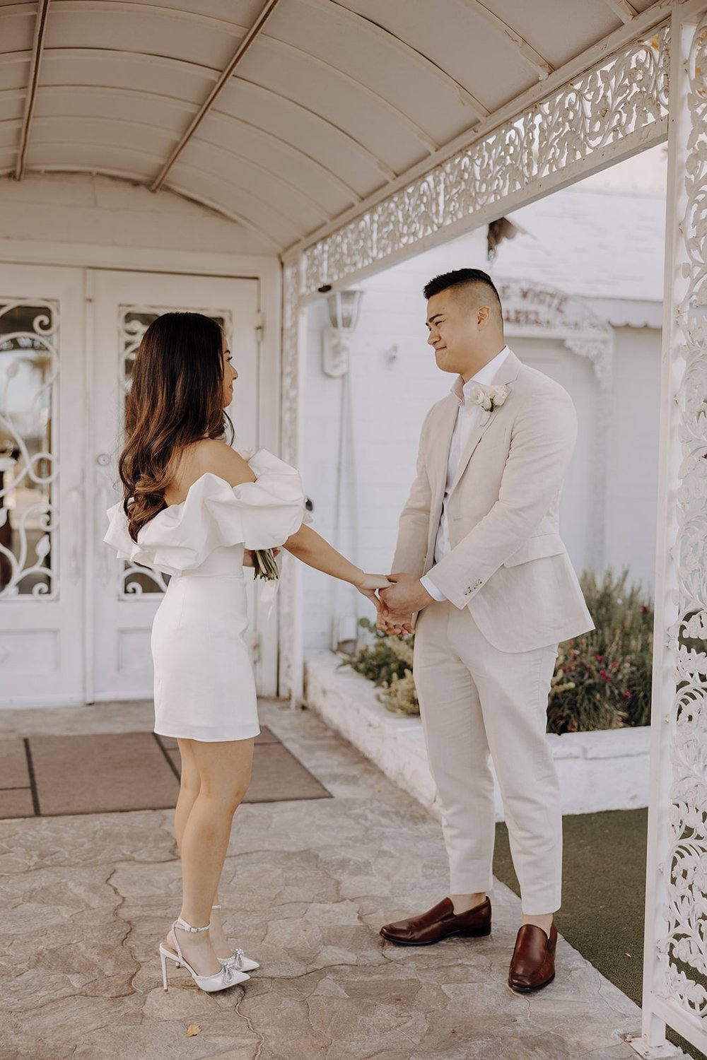 Groom turns around during a first look at the Little White Chapel in Las Vegas