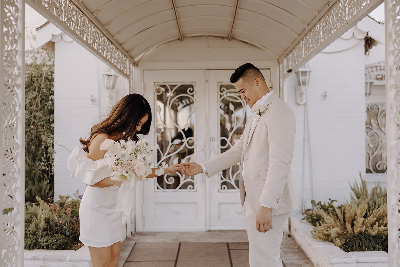 Bride and groom share a first look at their Las Vegas elopement at the Little White Chapel