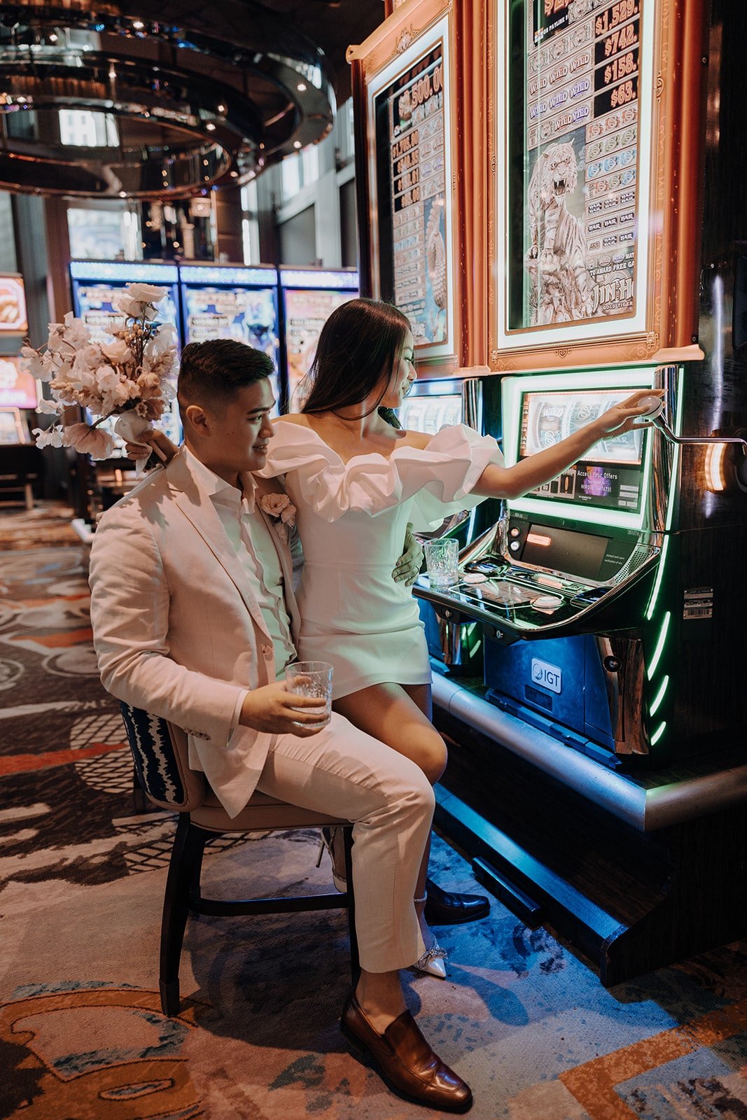 Bride and groom play in a Casino during their Las Vegas elopement