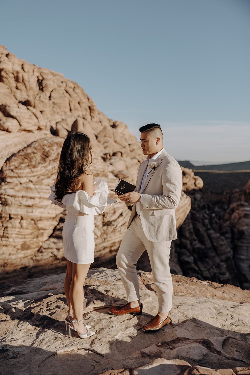 Bride and groom exchange personal vows at Red Rock Canyon