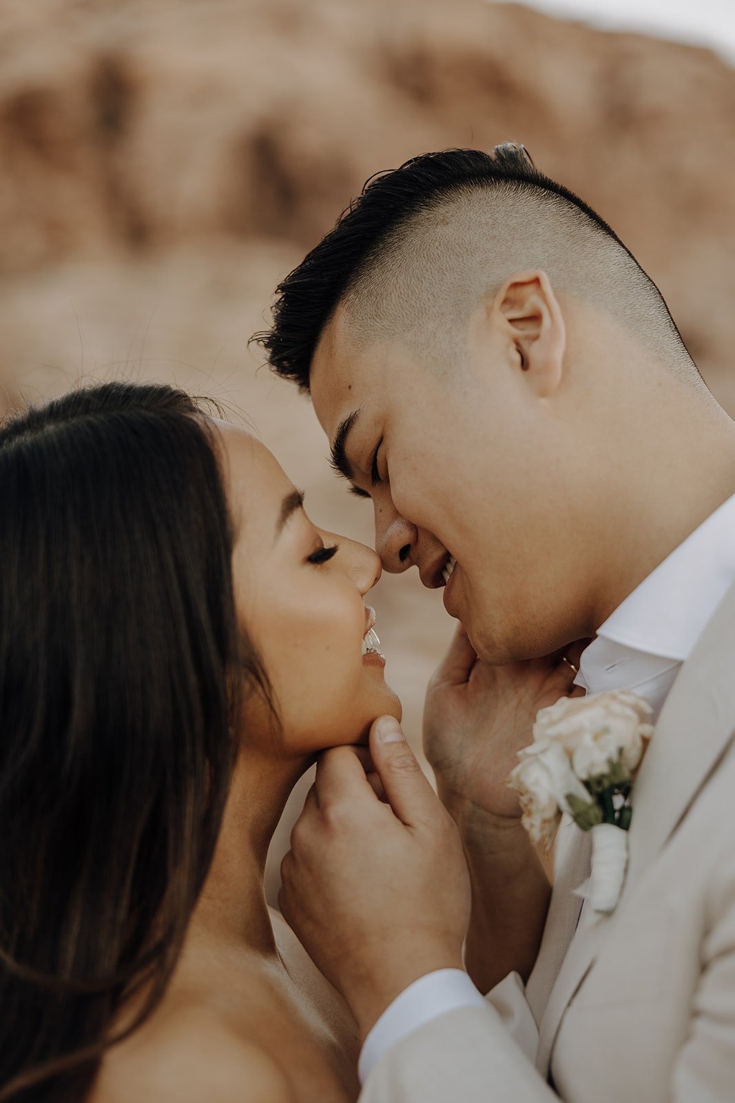 Bride and groom kiss for their elopement photos at Red Rock Canyon