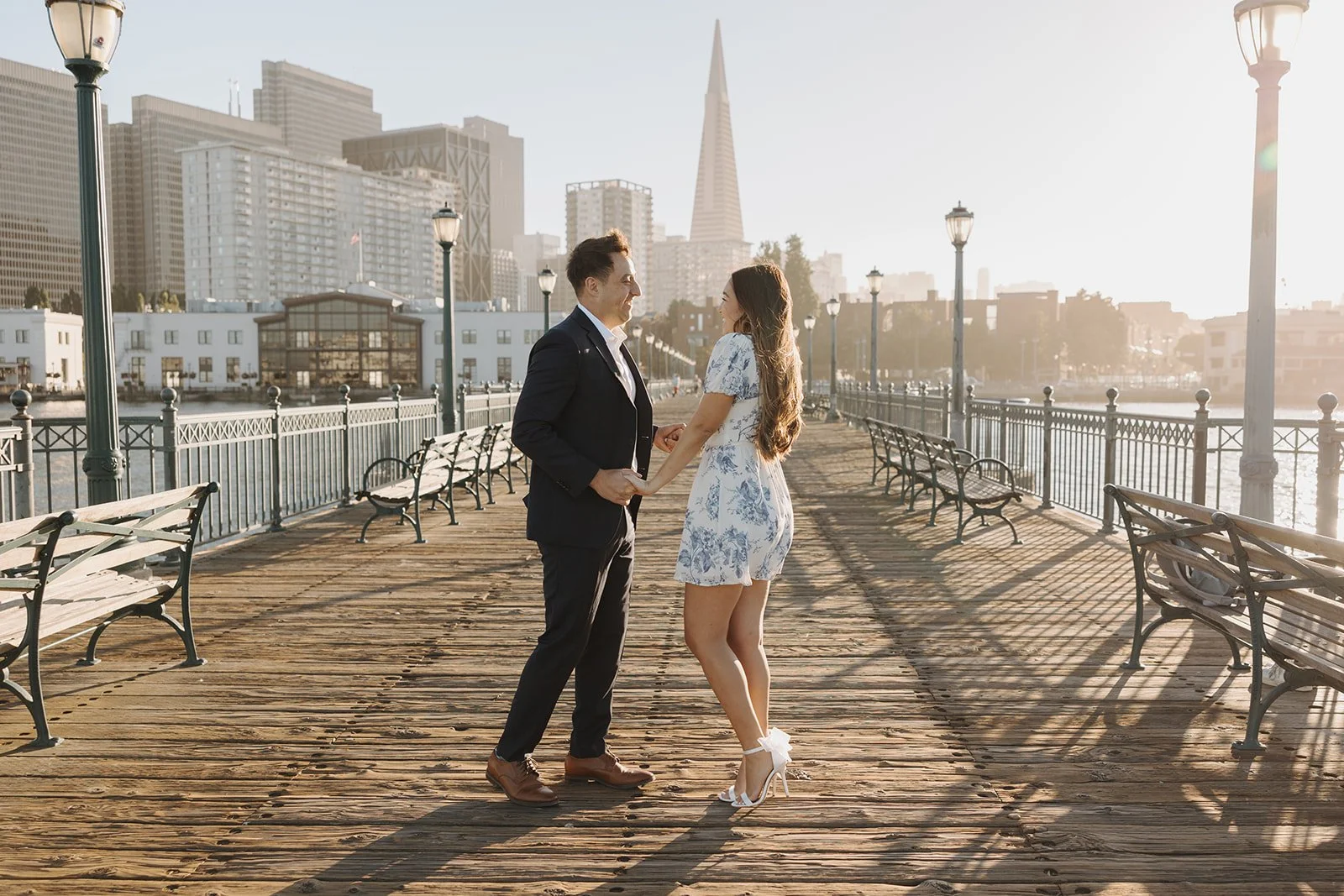 couple takes bay area engagement photos at Pier 7 in San Francisco