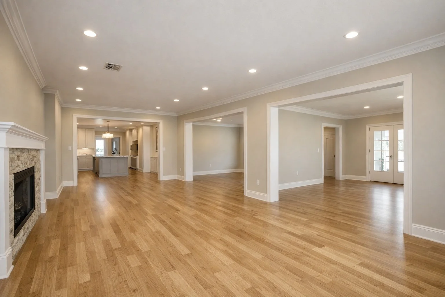 Completed whole-home renovation interior in Louisiana featuring updated flooring, fresh paint, finished trim work, and improved lighting.