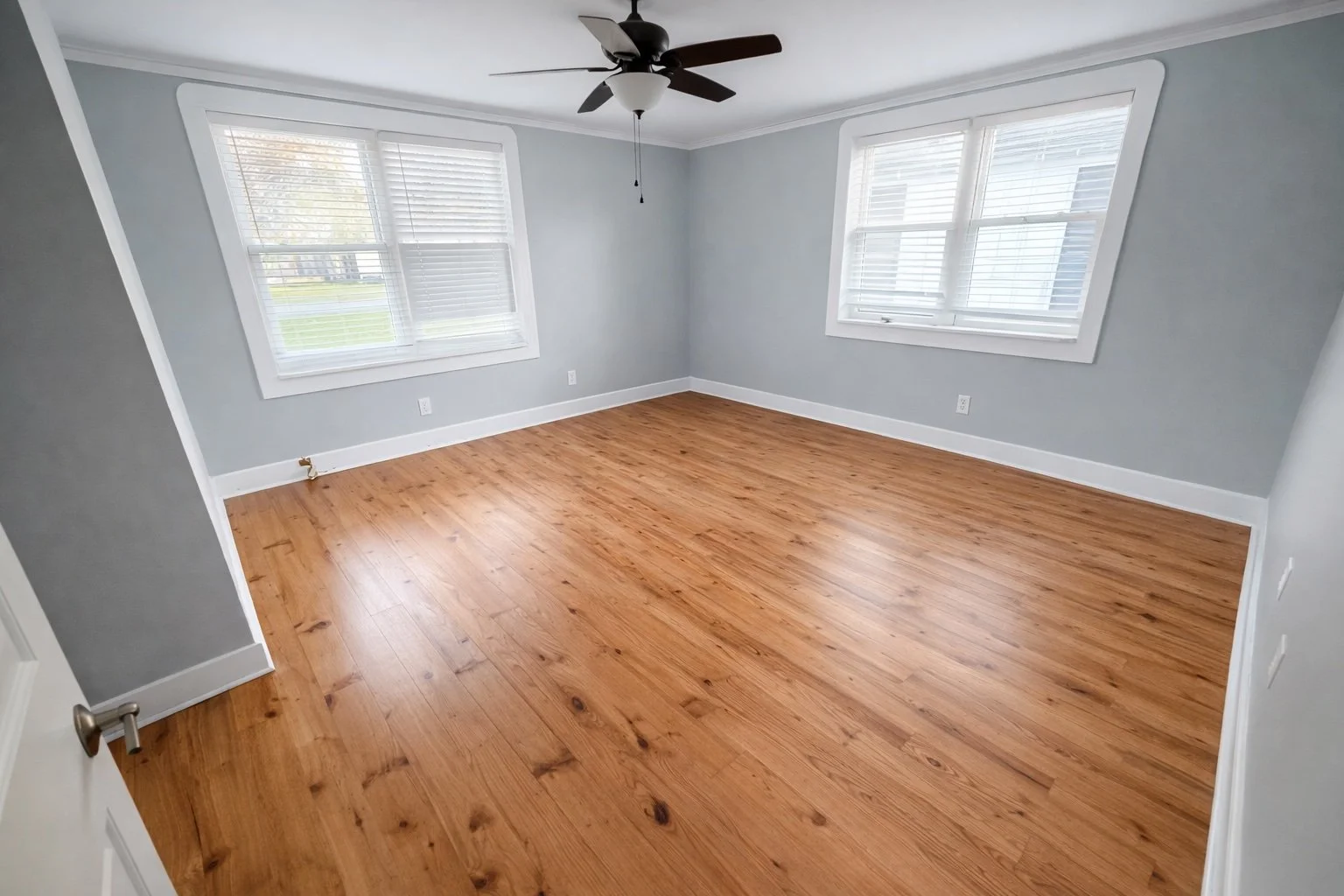 Pine hardwood flooring installed in a renovated residential home in Louisiana