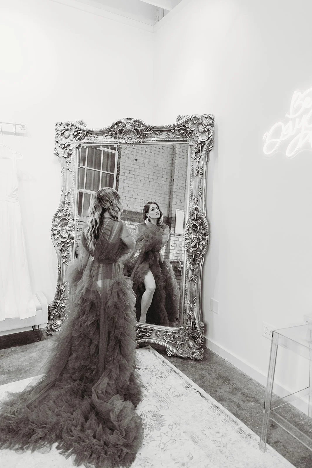 Industrial warehouse wedding venue at Studio 215 in Fayetteville, NC, located near Raleigh and Fort Bragg, featuring exposed brick, bistro lighting, and a modern chic aesthetic for weddings and events. 