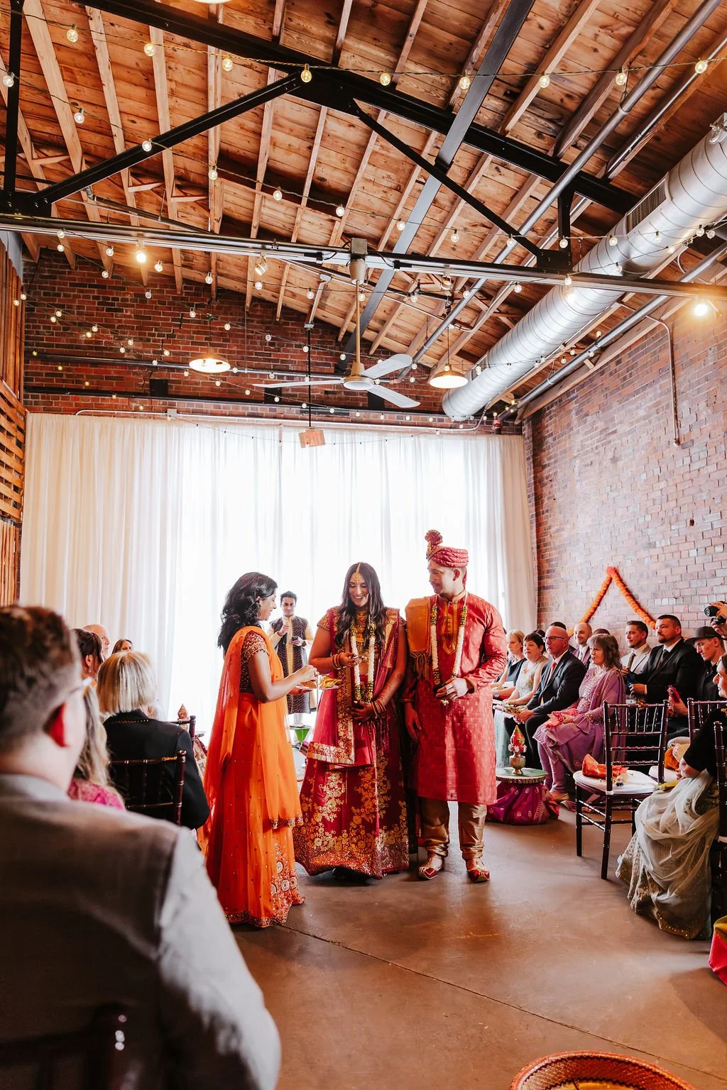 Studio 215 industrial-chic wedding and event venue in Fayetteville, NC, featuring exposed brick, high ceilings, and modern warehouse architecture for ceremonies and receptions.