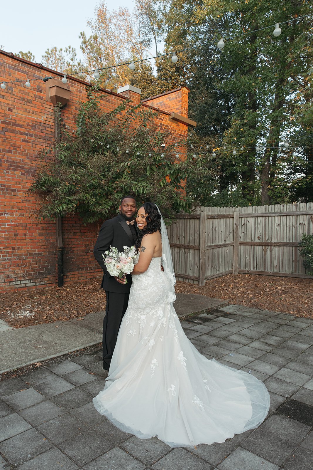 Industrial-chic wedding venue at Studio 215 near Fort Bragg, NC, featuring a luxury bridal suite, exposed brick walls, and modern warehouse charm for ceremonies and receptions.